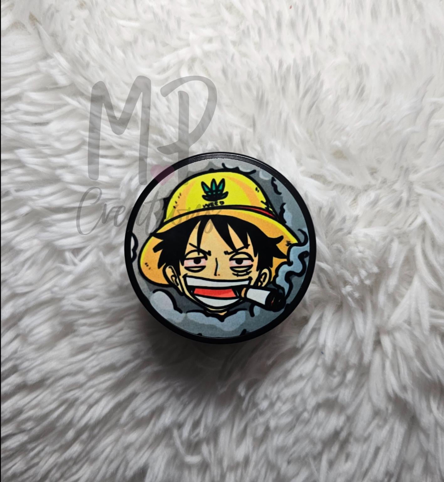 One Piece Luffy Grinder and Zippo Lighter featuring Luffy's vibrant yellow hat, perfect for collectors.