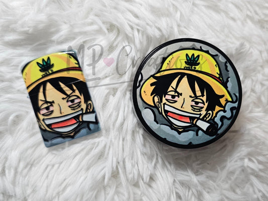 One Piece Luffy Grinder and Zippo Lighter set featuring a vibrant illustration of Luffy in his iconic yellow hat.